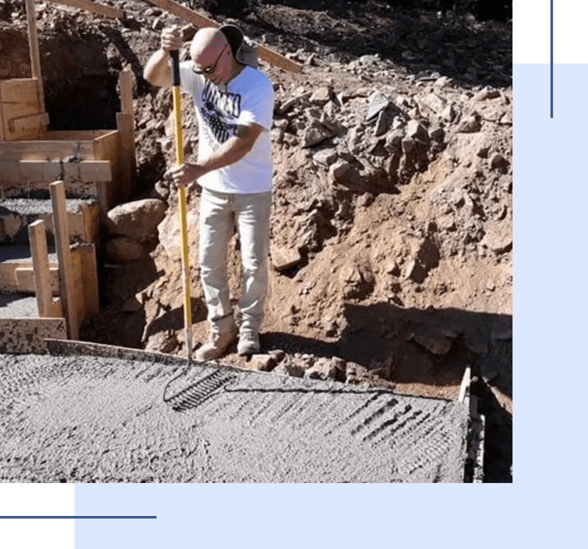 Worker using a jackhammer on a construction site.