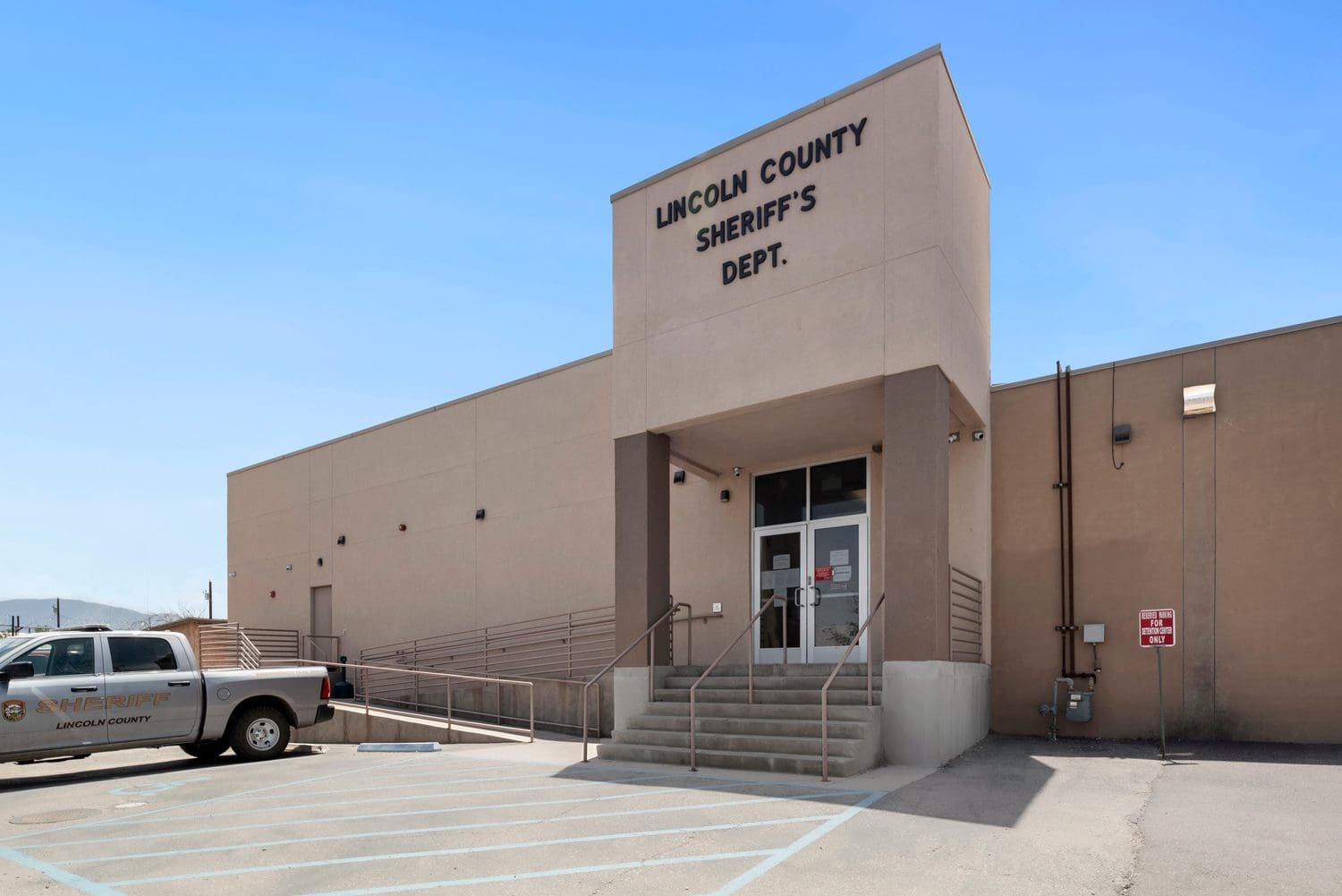 Exterior of the Washoe County Sheriff's Office Jail 3 building under clear blue sky.