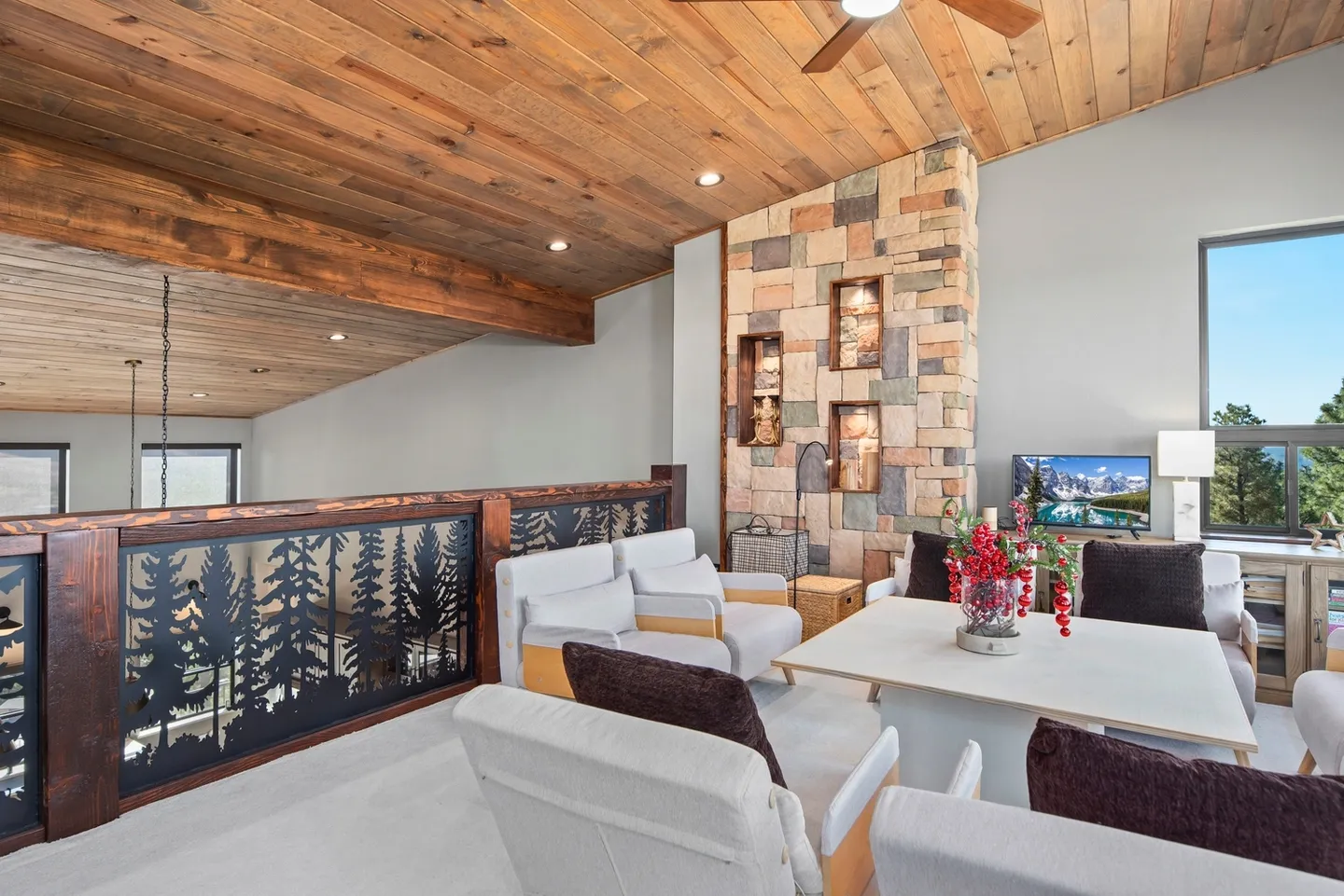 Modern living room with wooden ceiling and stylish furniture.